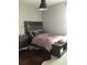 Cozy bedroom featuring stylish decor, soft lighting, and comfortable furnishings for a restful retreat at 15708 Orange Harvest Loop, Winter Garden, FL 34787