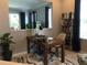 Functional home office space with a wooden desk, shelving, and ample natural light at 15708 Orange Harvest Loop, Winter Garden, FL 34787
