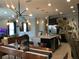 Inviting living area with modern lighting and views of the kitchen and dining space at 15708 Orange Harvest Loop, Winter Garden, FL 34787