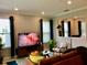 Bright, open living room featuring modern decor, ample seating, and natural light for a welcoming atmosphere at 15708 Orange Harvest Loop, Winter Garden, FL 34787