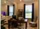 Comfortable home office space with a desk, chair, and natural light at 15708 Orange Harvest Loop, Winter Garden, FL 34787
