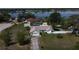 Aerial view of the home showing the lawn and proximity to the lake at 1100 Peak Cir, Deltona, FL 32738