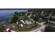 Aerial view of neighborhood with lake in background at 1100 Peak Cir, Deltona, FL 32738
