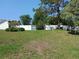 Large yard featuring a white fence at 1100 Peak Cir, Deltona, FL 32738