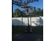 Image of basketball hoop sitting in front of a white fence at 1100 Peak Cir, Deltona, FL 32738
