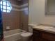 Bathroom with tub/shower combo, toilet, and vanity with window at 1100 Peak Cir, Deltona, FL 32738