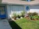Home featuring a blue door and hexagon window detail at 1100 Peak Cir, Deltona, FL 32738