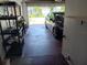 Car parked in a spacious garage with storage shelves at 1100 Peak Cir, Deltona, FL 32738