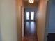 Hallway with doors and views to other areas of the home at 1100 Peak Cir, Deltona, FL 32738