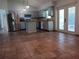Spacious kitchen with stainless steel appliances and gray cabinets and tile flooring at 1100 Peak Cir, Deltona, FL 32738