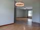 Open-concept living room showcasing continuous laminate flooring into the adjacent living space at 1100 Peak Cir, Deltona, FL 32738