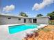 Inviting backyard with a refreshing pool, patio, and attractive landscaping at 116 7Th St, Winter Haven, FL 33880