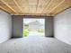 The basement features block wall construction with a view of the back yard and shed at 116 7Th St, Winter Haven, FL 33880