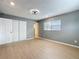 Bedroom features include wood flooring, closet with white doors and modern ceiling fan at 116 7Th St, Winter Haven, FL 33880