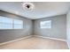 Bedroom showcasing natural light with wood flooring, gray paint, two windows and ceiling fan at 116 7Th St, Winter Haven, FL 33880
