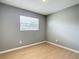The bedroom has a large window with a view of the neighborhood at 116 7Th St, Winter Haven, FL 33880