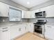 Renovated kitchen with granite countertops and stainless steel appliances at 116 7Th St, Winter Haven, FL 33880