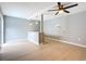 Open-concept living area with tile flooring, a fan and sliding glass door at 116 7Th St, Winter Haven, FL 33880