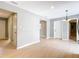 Open living room with light-colored floors and neutral walls leading to other rooms at 116 7Th St, Winter Haven, FL 33880