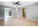 Light-filled living room with views into kitchen and bathroom and light wood flooring at 116 7Th St, Winter Haven, FL 33880