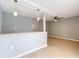 Living area features an accent wall, tile flooring, fan and bar at 116 7Th St, Winter Haven, FL 33880