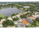 Aerial view featuring waterfront homes, lush greenery, and serene lakes, showcasing a beautiful community and scenic landscape at 1266 Saint Albans Loop, Lake Mary, FL 32746