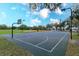Well-maintained basketball court featuring lighting for evening games, set in a grassy area at 1266 Saint Albans Loop, Lake Mary, FL 32746
