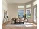 Bright dining room with large windows, modern decor, and seating for six around a wooden table at 1266 Saint Albans Loop, Lake Mary, FL 32746