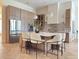 Bright kitchen features stainless steel appliances, modern cabinets, and a large center island with seating at 1266 Saint Albans Loop, Lake Mary, FL 32746