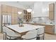 Stunning kitchen with a large island, stainless steel appliances, modern cabinets, and pendant lighting at 1266 Saint Albans Loop, Lake Mary, FL 32746