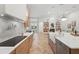Modern kitchen featuring a large island, sleek countertops, stainless steel appliances, and open layout at 1266 Saint Albans Loop, Lake Mary, FL 32746