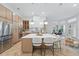 Open-concept kitchen with a spacious island, stainless steel appliances, and modern finishes at 1266 Saint Albans Loop, Lake Mary, FL 32746
