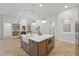 Well-equipped kitchen with a farmhouse sink, large island, modern appliances, and seamless open layout at 1266 Saint Albans Loop, Lake Mary, FL 32746