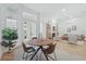 Open-concept living room with dining area and lots of natural light at 1266 Saint Albans Loop, Lake Mary, FL 32746