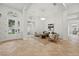 Bright living room with high ceilings, herringbone floors, modern furnishings, and abundant natural light at 1266 Saint Albans Loop, Lake Mary, FL 32746