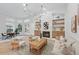 Bright living room with fireplace, built-in shelves, and modern decor at 1266 Saint Albans Loop, Lake Mary, FL 32746