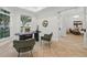 Serene home office featuring a large window, modern desk, and comfortable seating at 1266 Saint Albans Loop, Lake Mary, FL 32746