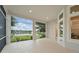 Expansive screened patio offers stunning views of the lake, blue skies, and lush green landscape, perfect for relaxation at 1266 Saint Albans Loop, Lake Mary, FL 32746