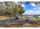 Community playground featuring swings, see-saws and a gazebo, set amidst mature trees at 1266 Saint Albans Loop, Lake Mary, FL 32746