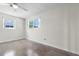 Bedroom with two windows offering ample natural light and terrazzo flooring for a clean, modern look at 1340 Continental Dr, Daytona Beach, FL 32117