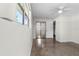 Spacious bedroom features terrazzo flooring, a mirrored closet, and a ceiling fan for added comfort and style at 1340 Continental Dr, Daytona Beach, FL 32117