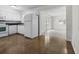 Bright kitchen featuring white cabinets, appliances, and seamless access to the adjacent living area at 1340 Continental Dr, Daytona Beach, FL 32117