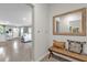 Welcoming entryway featuring tile flooring, a bench with pillows, and a view into the living area at 1555 Dawnview Way, Kissimmee, FL 34744