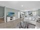 Spacious living area seamlessly connects to an open kitchen, creating an inviting and sociable space at 1555 Dawnview Way, Kissimmee, FL 34744