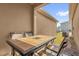 Relaxing outdoor dining space featuring a stone-top table and seating on a screened patio at 1555 Dawnview Way, Kissimmee, FL 34744