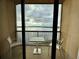 Balcony featuring a table and chairs with scenic views of the water at 16300 County Road 455 # 703, Montverde, FL 34756