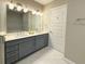 Modern bathroom with double sink vanity at 16300 County Road 455 # 703, Montverde, FL 34756