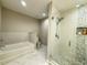 Bright bathroom with walk-in shower and soaking tub at 16300 County Road 455 # 703, Montverde, FL 34756