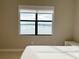 Bright bedroom with a bed and lakeside view at 16300 County Road 455 # 703, Montverde, FL 34756