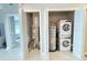 This utility closet features an HVAC, water heater and a stacked washer dryer at 16300 County Road 455 # 703, Montverde, FL 34756